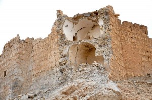 This photo released by the Syrian official news agency SANA, shows damage to the Palmyra citadel following fighting between Government forces and Islamic State group militants in Palmyra, Syria, Sunday, March 27, 2016. Syrian state media and an opposition monitoring group say government forces backed by Russian airstrikes have driven Islamic State fighters from the historic central town of Palmyra, held by the extremists since May. (SANA via AP)