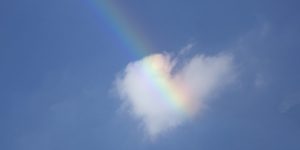Heart shaped cloud and a rainbow